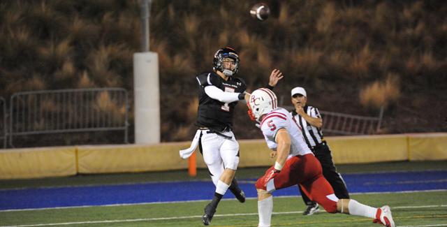 Mike Chislock throws a pass to one of his receivers over a Bakersfield College defender in the Dons 24-9 loss to open the season.