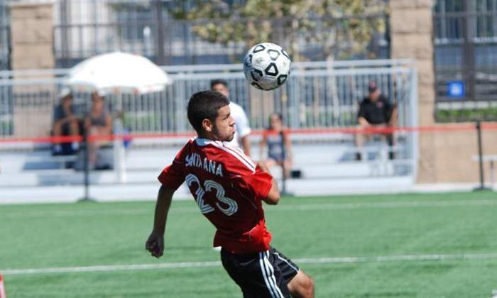 Jesse Rodriguez-Vazquez heads a ball pack into play at midfield during the Dons match against East Los Angeles College.
