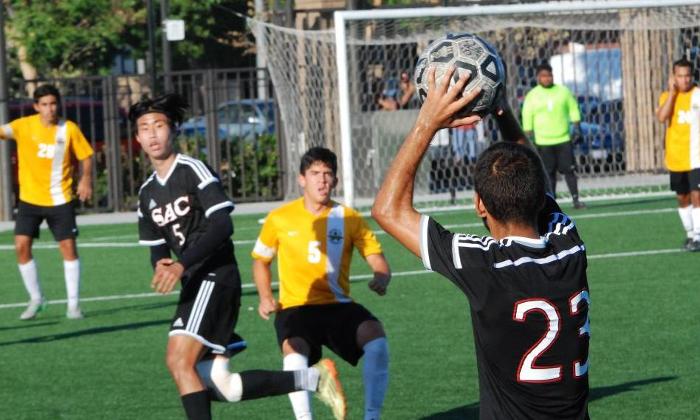 Jesse Rodriguez-Vasquez (23) throws the ball into Jangho Yoon (5) in the Dons match against Golden West College. Yoon had the Dons best scoring opportunity of the match.