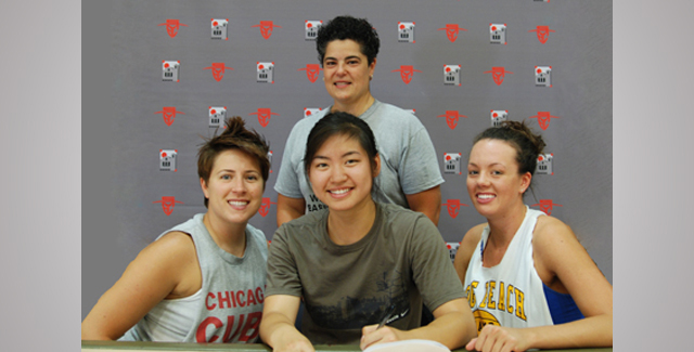 Anna Nguyen (seated, center) signs her National Letter of Intent to attend Cal State San Marcos. She is joined by Head Coach Flo Luppani (standing, center) and assistant coaches Annie Wingard (left) and Heather Couzens (right).