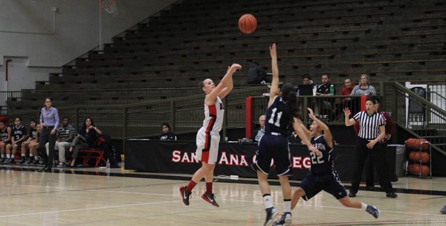 Ashley Whisler hits one of her five three-pointers in the Dons 68-52 win over Fullerton College. Photo by Tony McAndrew.