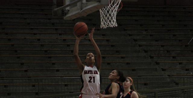 Jazmine Johnson lays in a basket as she finished with 21 points and 11 rebounds in the Dons loss to Orange Coast College. (Photo courtesy of Tony McAndrew)