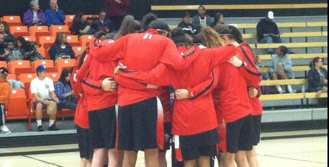 The Dons huddle as a team moments before their second round matchup with Ventura College.