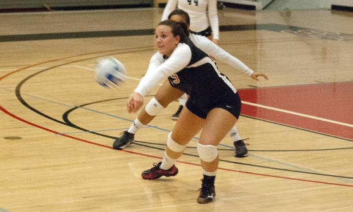 Madison Logan digs a ball in the Dons season opener against San Diego City College.