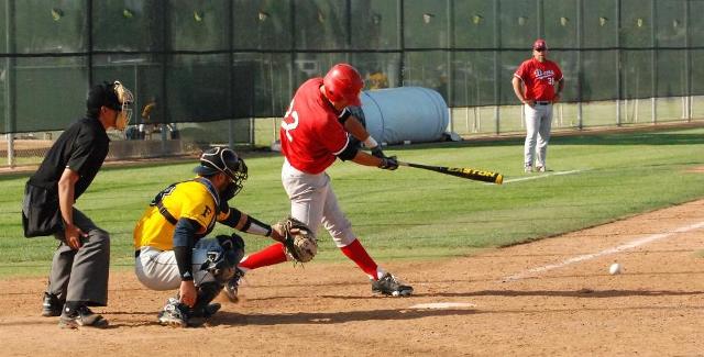 Nestor Linares drives the ball against Fullerton College. Linares hit a home run for the Dons in the fourth inning.