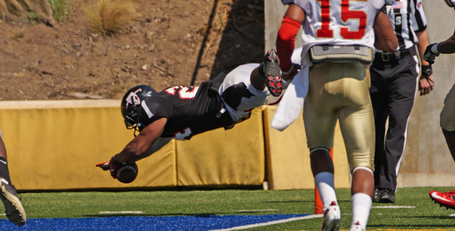 Areseo Lakey dives into the end zone on his 27-yard touchdown reception in the Dons 38-20 win over College of the Desert.