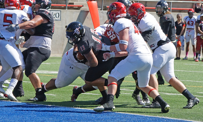 Arthur Tuason pushes his way through the Chaffey defense for one of his two touchdowns in the first quarter.