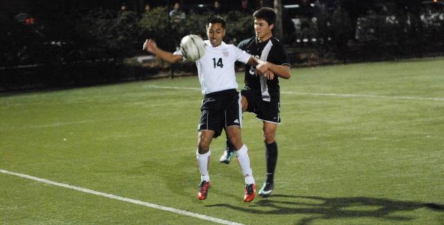 Eduardo Pantoja (14) fights off a Rio Hondo defender to control the ball on the sidelines.