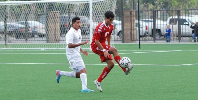 Jose Angulo controls the ball in front of an Irvine Valley College defender. Angulo scored a goal in the Dons 5-1 win.