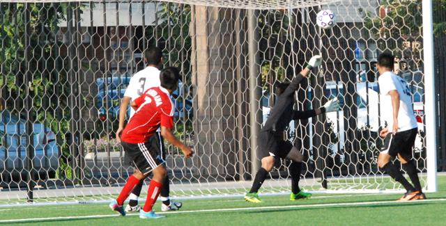 Chris Cruz watches as his second goal goes over the arms of San Bernardino Vallley College's goalkeeper in the Dons 3-2 loss.