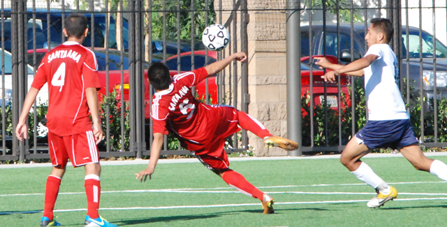 Edwin Navarrete (5) leaves his feet to score a goal in the Dons 6-0 win over Cypress College.