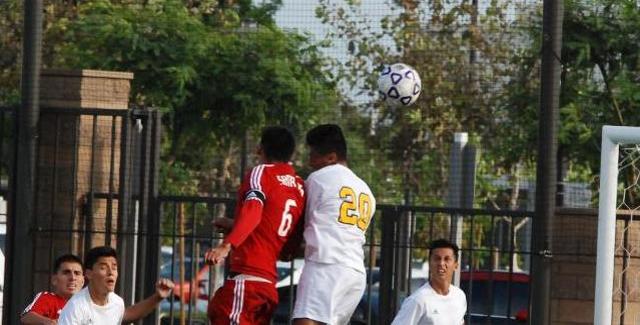 Jose Lopez battles a Fullerton defender mid-air in the Dons 1-1 tie. Lopez scored the Dons goal in the 17th minute on a header.