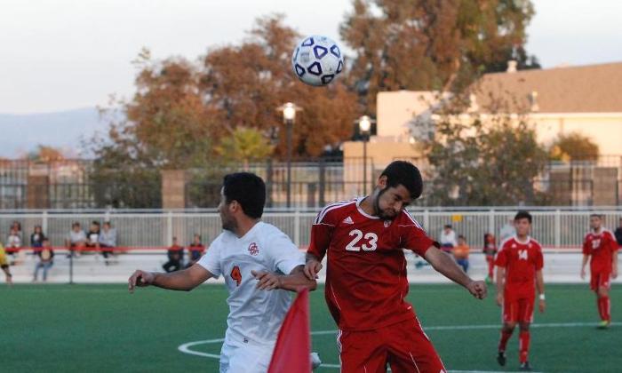 Jesse Rodriguez-Vazquez heads a ball pack into play at midfield during the Dons match against Orange Coast College.