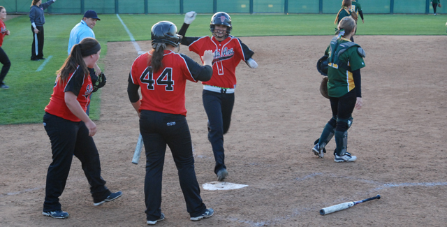 Genna Main is greeted at home plate by Sabrina Perez (44) and Danielle Hernandez as she scores the game-winning run in the Dons 10-9 walk-off win over Grossmont.