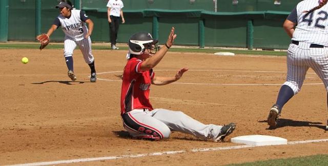 Natalie Wolf slides into third base with her first inning triple that score Emily Whitecavage. (Photo courtesy of Tony McAndrew)