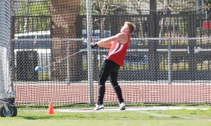 Alexander Griffith gains momentum in the hammer throw. He led the men's team with a second place finish in the discus throw.