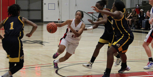 Berlin Ohanesian drives against a pair of Merced defenders. She led all scorers with 13 points in the Dons semifinal loss to Merced. Photo by Tony McAndrew