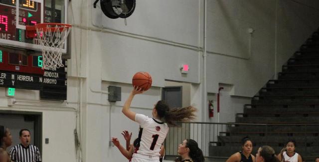 Ashley Whisler puts up a shot in the key against Cypress. Whisler scored 15 points in the Dons 84-66 loss to the Chargers. (Photo courtesy of TonyMcAndrew)