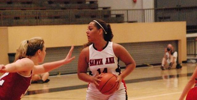 Jordan Roberson-McCanless surveys the court with a Palomar defender in her face.