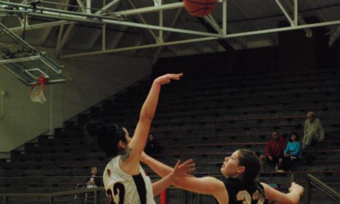 Kylie Rodriguez lifts a hook shot over a Cypress defender. She finished with 11 points and 10 rebounds.