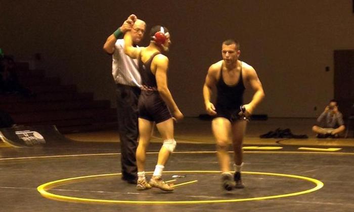 Richard Miranda, pictured in the middle, led the way for the Dons with a 19-7 majority decision to improve to 3-0 in conference duals.