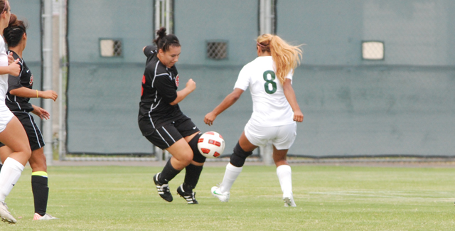 Kristina Alatorre (left) takes on an East Los Angeles defender in the Dons 3-2 loss. Alatorre scored late to tie the match at 2-2 before ELAC reclaimed the lead.
