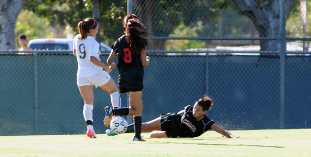 Yesenia Fonseca kicks the ball away from a Cougars attacker in the Dons 2-1 loss to College of the Canyons.