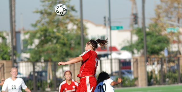 Kristina Alatorre heads a ball into the offensive zone for the Dons. Alatorre scored the Dons second goal of their match against Golden West College.