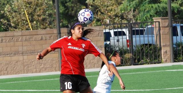 Cristina Lizarraga heads a ball in the Dons match against San Bernardino Valley College.