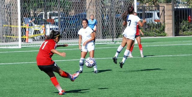 Gabriela Rodriguez sends a ball in on a Dons set piece against Cypress College.