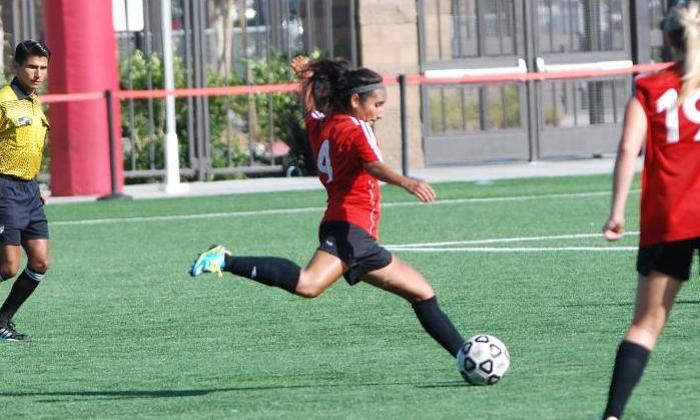 Gabriela Rodriguez lines up a shot in the Dons match with Cypress College.