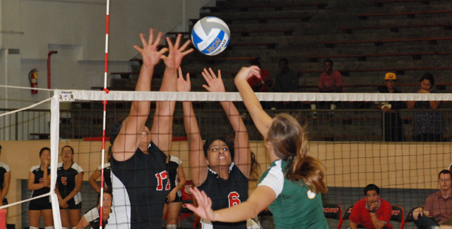 Sutaita Tameifuna (left) and Yvonne Reyes alter a Rustlers shot in the Dons match against Golden West College.