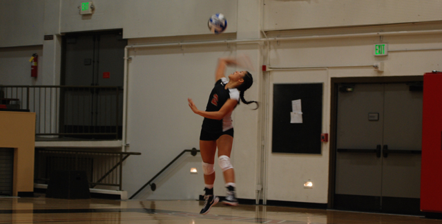 Michelle Nguyen hits a jump serve in the Dons straight-set win over Cerro Coso. Nguyen finished the game with six service aces for the Dons.
