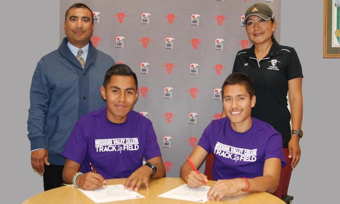 Geovany Garcia (seated, left) and Edwin Ortiz-Lopez (seated, right) each signed a letter of intent to compete for Missouri Valley College.